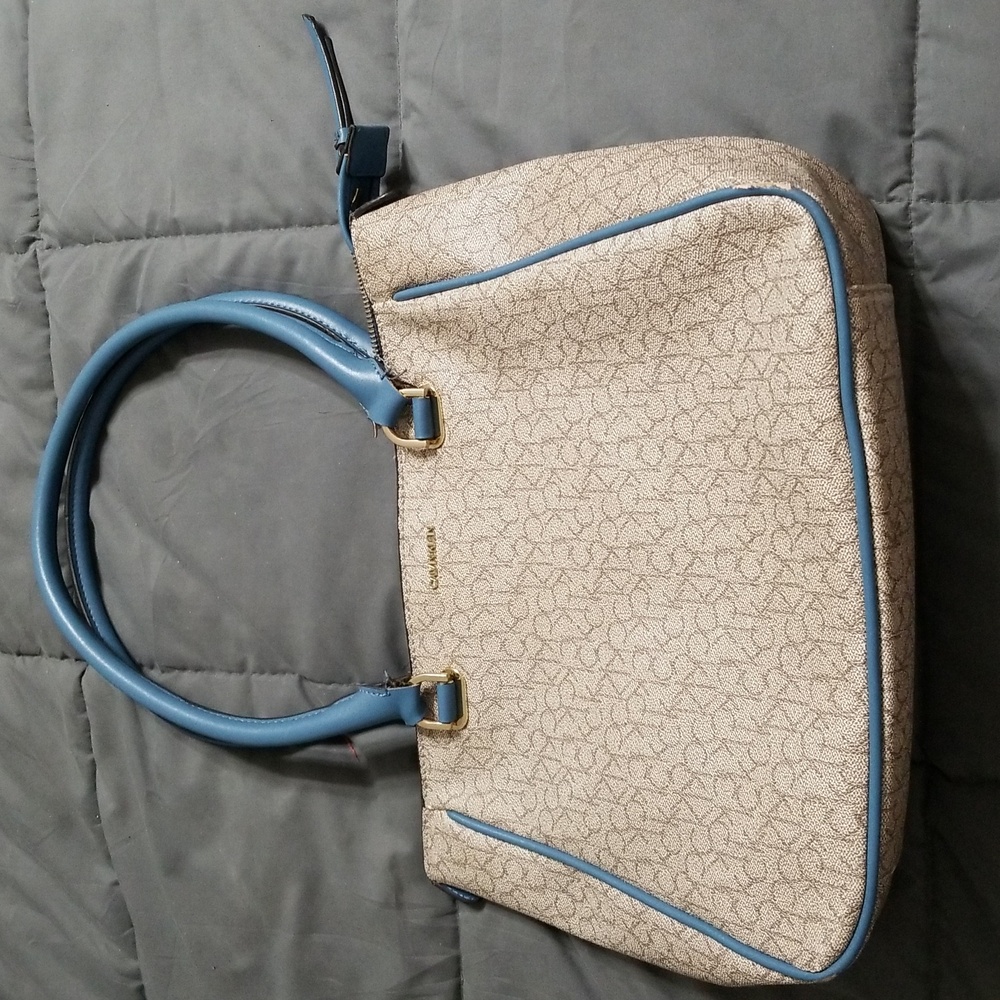 Calvin Klein pocketbook with sky blue handles and trim